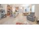 Open kitchen with stainless appliances, large island with seating, and view of living area at 1669 Ludington Ave, Wesley Chapel, FL 33543