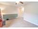 A cozy living room is furnished with a long green cabinet and a ceiling fan at 1669 Ludington Ave, Wesley Chapel, FL 33543