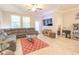 Comfortable living room featuring a large sectional sofa, tile floor, and natural light at 1669 Ludington Ave, Wesley Chapel, FL 33543
