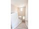 Bright staircase with neutral carpet leads to a front door with lots of natural light at 1669 Ludington Ave, Wesley Chapel, FL 33543