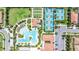 Aerial view showcasing a large pool, tennis courts, clubhouse, and beautiful landscaping at 16938 Scuba Crest St, Wimauma, FL 33598