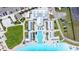 Bird's eye view showcases the community's amenities, featuring a pool, beach, and cabanas for relaxation at 16938 Scuba Crest St, Wimauma, FL 33598