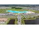Overhead shot of the community's beach and lagoon area featuring a sandy shore and crystal-clear turquoise waters at 16938 Scuba Crest St, Wimauma, FL 33598