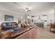 Open-concept living space with seamless flow between living room and kitchen, ideal for entertaining at 16938 Scuba Crest St, Wimauma, FL 33598