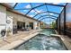 A screened in pool and bubbling hot tub at 16938 Scuba Crest St, Wimauma, FL 33598