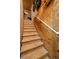 Stairway with wood steps and white handrail at 16938 Scuba Crest St, Wimauma, FL 33598