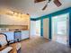Bedroom featuring a kitchenette and a doorway to the bathroom at 1861 Royal Oak E Pl, Dunedin, FL 34698