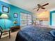 Bright bedroom featuring a kitchenette and ample natural light at 1861 Royal Oak E Pl, Dunedin, FL 34698