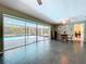 Tile floors and views of the pool in the dining and living area at 1861 Royal Oak E Pl, Dunedin, FL 34698