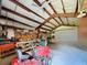 Spacious garage featuring a workshop area with ample tool storage and work space at 1861 Royal Oak E Pl, Dunedin, FL 34698
