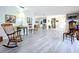 Open-concept home featuring wood floors at 1861 Royal Oak E Pl, Dunedin, FL 34698