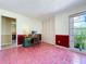 Office with tile floors, large window providing ample natural light, and traditional closet at 1861 Royal Oak E Pl, Dunedin, FL 34698