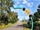 Picturesque Palm Harbor trail with green scenery and charming roadside accents for a scenic route at 1861 Royal Oak E Pl, Dunedin, FL 34698