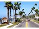 Welcoming entry to Dunedin featuring palm-lined streets and a scenic coastal view at 1861 Royal Oak E Pl, Dunedin, FL 34698