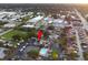 Aerial shot of residential area with tennis courts, swimming pool, and community parking at 1881 N Hercules Ave # 1501, Clearwater, FL 33765
