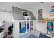 Playful bedroom featuring unique house-shaped bunk bed and colorful decor at 1881 N Hercules Ave # 1501, Clearwater, FL 33765