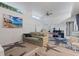Bright living room with neutral walls and charming starfish patterned carpet for relaxed coastal-inspired feel at 1881 N Hercules Ave # 1501, Clearwater, FL 33765
