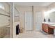 Bathroom featuring tile floors, a large shower, and a modern vanity with plenty of counter space at 19418 Butterwood Ln, Lutz, FL 33558