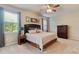 Relaxing main bedroom featuring carpet floors, ceiling fan, and neutral color scheme at 19418 Butterwood Ln, Lutz, FL 33558