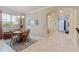 Cozy dining area boasts natural light, seating for four, and an inviting transition to the foyer at 19418 Butterwood Ln, Lutz, FL 33558