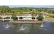 Community entrance sign, fountains, and manicured landscaping welcome you home at 19418 Butterwood Ln, Lutz, FL 33558