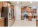 Modern kitchen with stainless steel appliances, granite countertops, and ample cabinet space at 19418 Butterwood Ln, Lutz, FL 33558