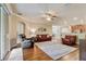 Open layout living room with hardwood floors, comfortable seating, and lots of natural light at 19418 Butterwood Ln, Lutz, FL 33558
