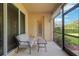 Screened lanai with comfortable seating to enjoy beautiful backyard views at 19418 Butterwood Ln, Lutz, FL 33558