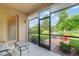 Enjoy beautiful backyard views from the screened lanai with easy access to the outdoor patio at 19418 Butterwood Ln, Lutz, FL 33558