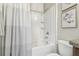 Bathroom featuring a white shower and tub combination with a shower curtain at 21284 Southern Charm Dr, Land O Lakes, FL 34637