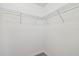 Walk-in closet features white walls, carpet, and wire shelving at 21284 Southern Charm Dr, Land O Lakes, FL 34637