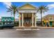 The elegant entrance to Club Connerton is framed by palm trees and features a porte-cochere at 21284 Southern Charm Dr, Land O Lakes, FL 34637