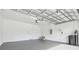 Spacious two-car garage with white walls and overhead door at 21284 Southern Charm Dr, Land O Lakes, FL 34637