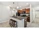 Modern kitchen featuring an island with stools and sleek appliances at 21284 Southern Charm Dr, Land O Lakes, FL 34637