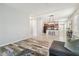 The living room opens to the kitchen and dining area with tile and wood flooring at 21284 Southern Charm Dr, Land O Lakes, FL 34637