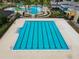Aerial view of a large lap pool within the community, complete with marked lanes at 21284 Southern Charm Dr, Land O Lakes, FL 34637