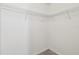 Empty walk-in closet equipped with wire shelving, providing ample storage space for organization at 21284 Southern Charm Dr, Land O Lakes, FL 34637