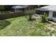 View of backyard area with a screened pool and fenced perimeter at 21426 Quesada Ave, Port Charlotte, FL 33952