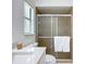 Bathroom with shower, toilet, blinds, and mirror at 21426 Quesada Ave, Port Charlotte, FL 33952