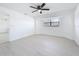 Bright bedroom with light floors, ceiling fan, and lots of natural light at 21426 Quesada Ave, Port Charlotte, FL 33952