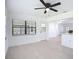 Sunlit dining space features fresh paint, new floors, ceiling fan, and updated windows overlooking the landscaped backyard at 21426 Quesada Ave, Port Charlotte, FL 33952