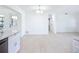 The dining area has a modern light fixture, fresh paint, and new floors at 21426 Quesada Ave, Port Charlotte, FL 33952