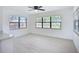 Dining room features large windows, neutral walls, and modern ceiling fan at 21426 Quesada Ave, Port Charlotte, FL 33952
