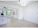 Bright dining area features fresh paint, new floors, and a new light fixture at 21426 Quesada Ave, Port Charlotte, FL 33952