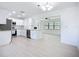 Bright kitchen features stainless appliances, white cabinets, and an open layout, creating a modern and inviting space at 21426 Quesada Ave, Port Charlotte, FL 33952