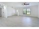 Bright living room featuring a large window, an entry door and modern light wood flooring at 21426 Quesada Ave, Port Charlotte, FL 33952