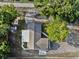 Aerial view of a home featuring a uniquely-shaped roof and surrounding foliage at 221 S Kingsway Rd, Seffner, FL 33584