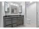 Updated bathroom with granite countertop, vanity, toilet and shower with glass door at 221 S Kingsway Rd, Seffner, FL 33584