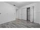 Cozy bedroom showcasing tile flooring, an open closet, and neutral paint at 221 S Kingsway Rd, Seffner, FL 33584
