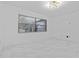 Bright bedroom with marble floors, modern lighting, and a large window with blind coverings at 221 S Kingsway Rd, Seffner, FL 33584